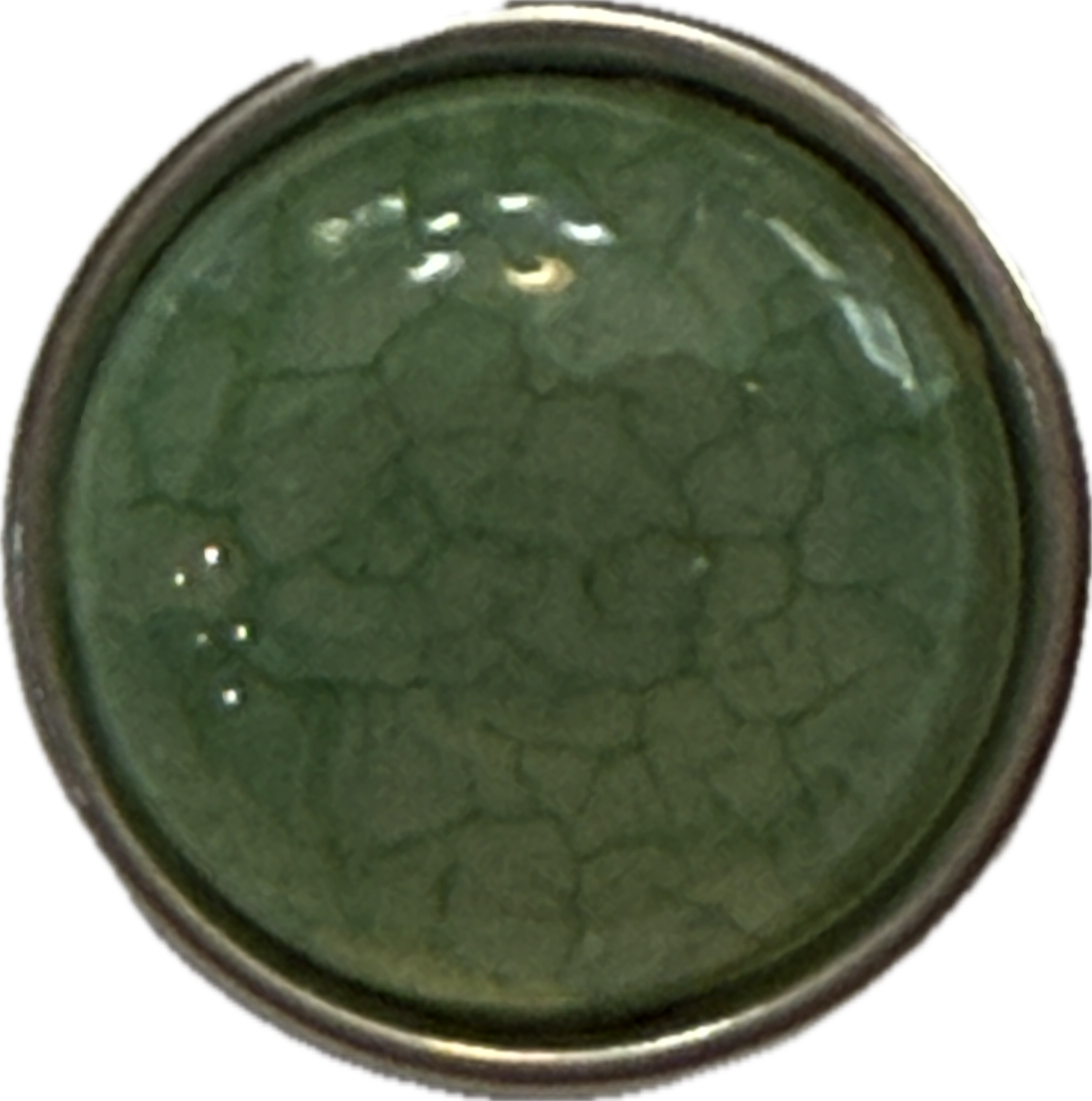 An acrylic jade green snap charm with a 18mm diameter, showcasing a solid green color with a textured, cracked appearance.