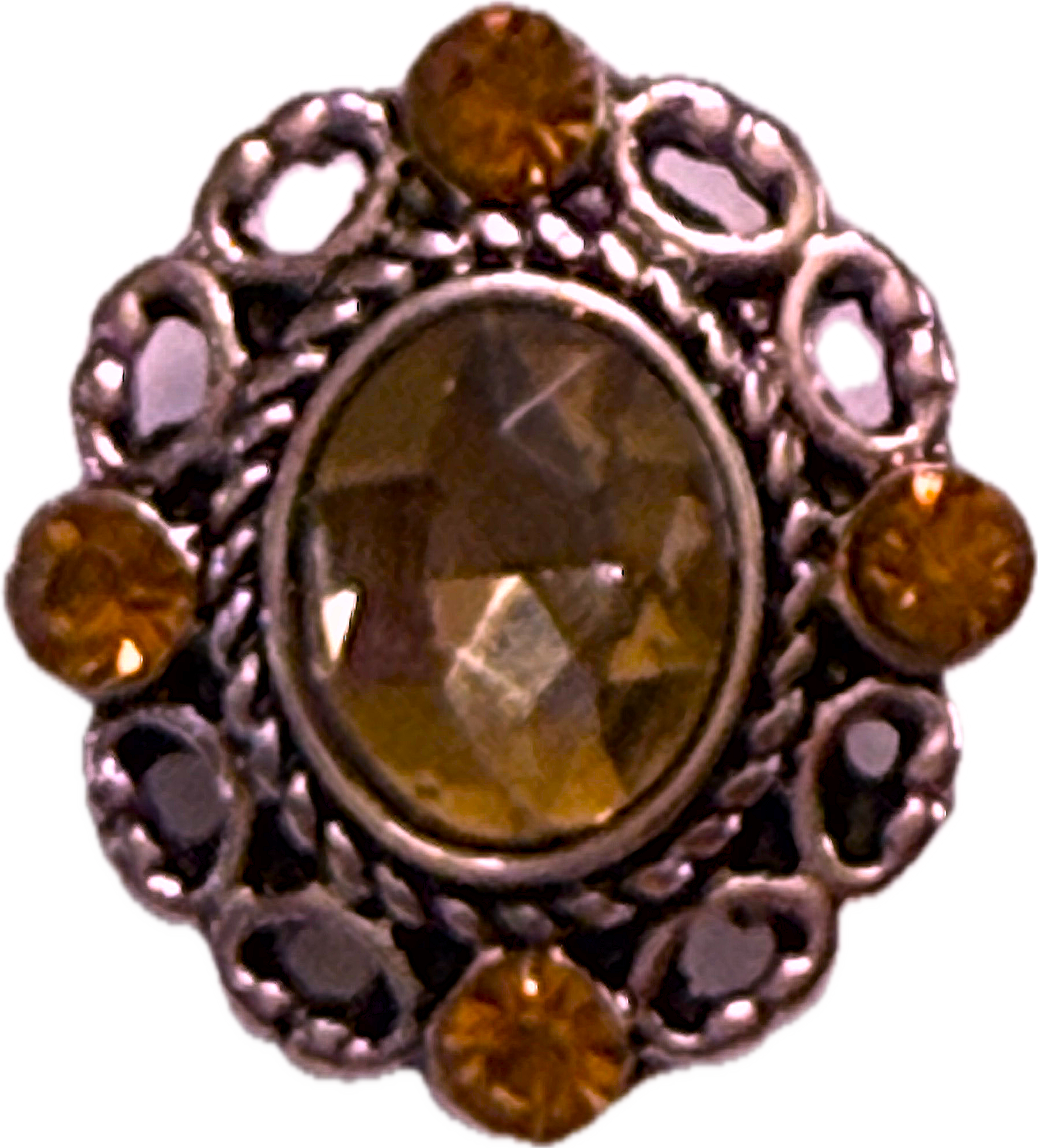 A snap charm with an oval rhinestone in the center and filigree edge, surrounded by smaller orange rhinestones.