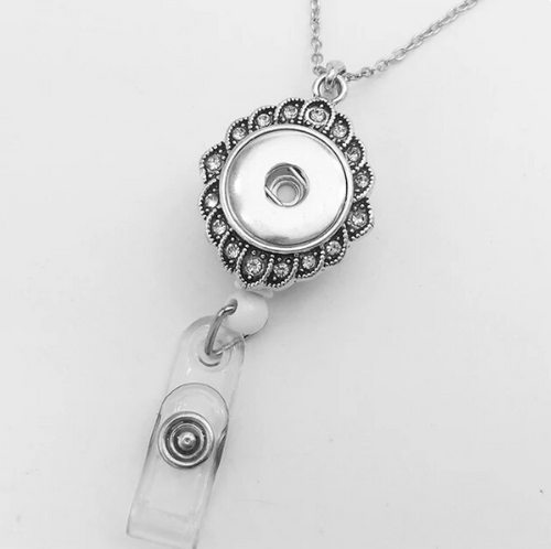 An antique diamond shape rhinestone retractable badge/key holder with a 20mm diameter rhinestone-studded design, silver in color, on a white background.