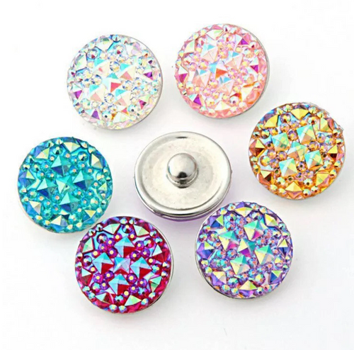 A selection of colorful acrylic diamond cut snap charms in assorted colors including pink, purple, blue, and multicolor, designed for snap charm jewelry.
