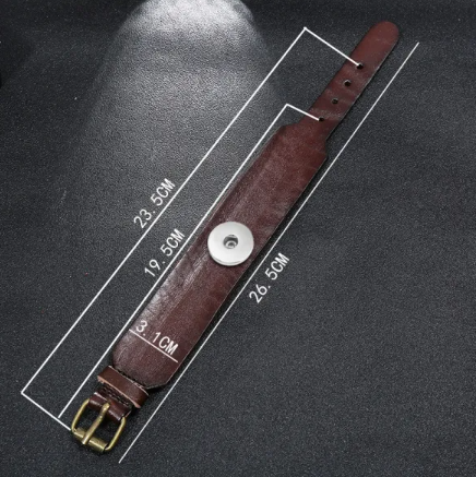 Brown leather strap with measurements on a black background