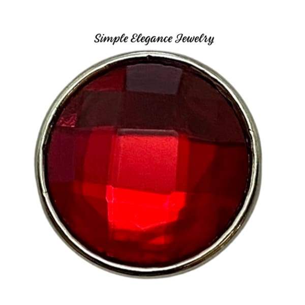 A round acrylic snap charm with a faceted pink design, set in a gold-colored metal frame.