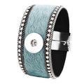 Simple Elegance Jewelry wide cuff bracelet in green faux fur with rhinestone trim and a 20mm magnetic snap closure.