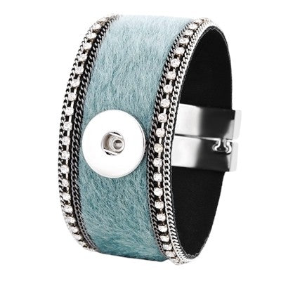 Simple Elegance Jewelry wide cuff bracelet in green faux fur with rhinestone trim and a 20mm magnetic snap closure.