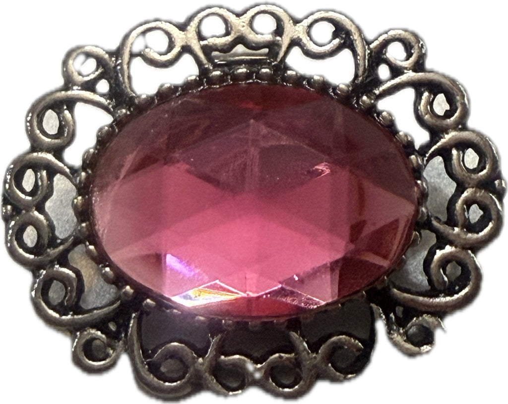 Simple Elegance Jewelry 20mm snap charm with a pink faceted center stone and an intricate silver filigree metal edge.