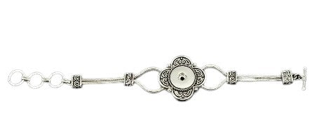 Simple Elegance Jewelry silver double chain bracelet featuring a decorative flower snap closure on a black background.