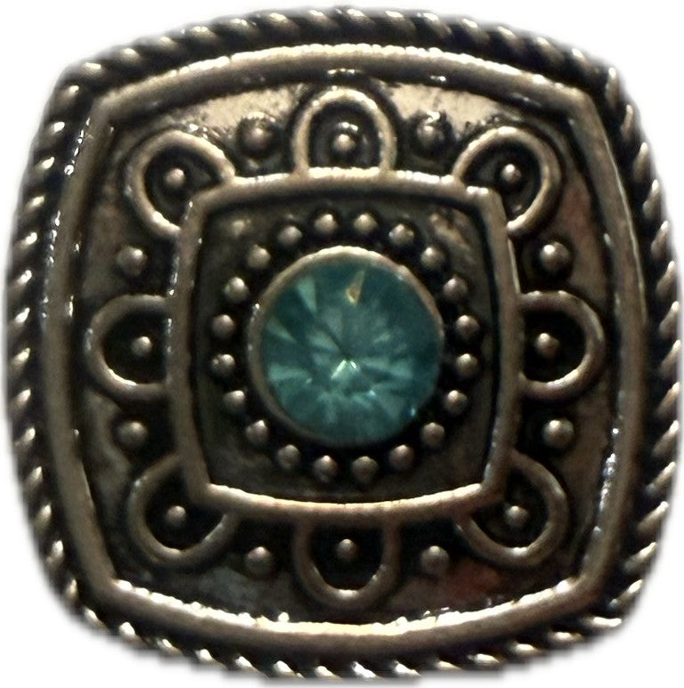 Simple Elegance Jewelry 20mm square snap charm with silver metal filigree and a central blue birthstone rhinestone
