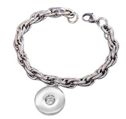 Simple Elegance Jewelry stainless steel cable link bracelet with a 20mm round dangle snap charm on a blue background.