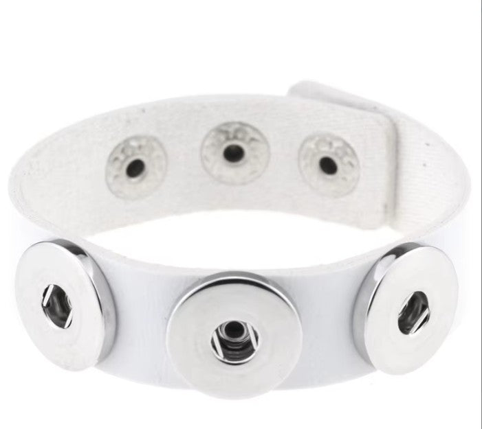 Simple Elegance Jewelry white leather triple snap bracelet featuring three silver-tone 20mm interchangeable snap bases.